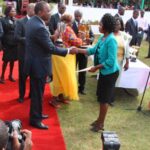 Janet Chebet receiving Best Youth Farmer award from President Uhuru Kenyatta during the 2015 Nairobi Agricultural Trade Fair Jamhuri Grounds