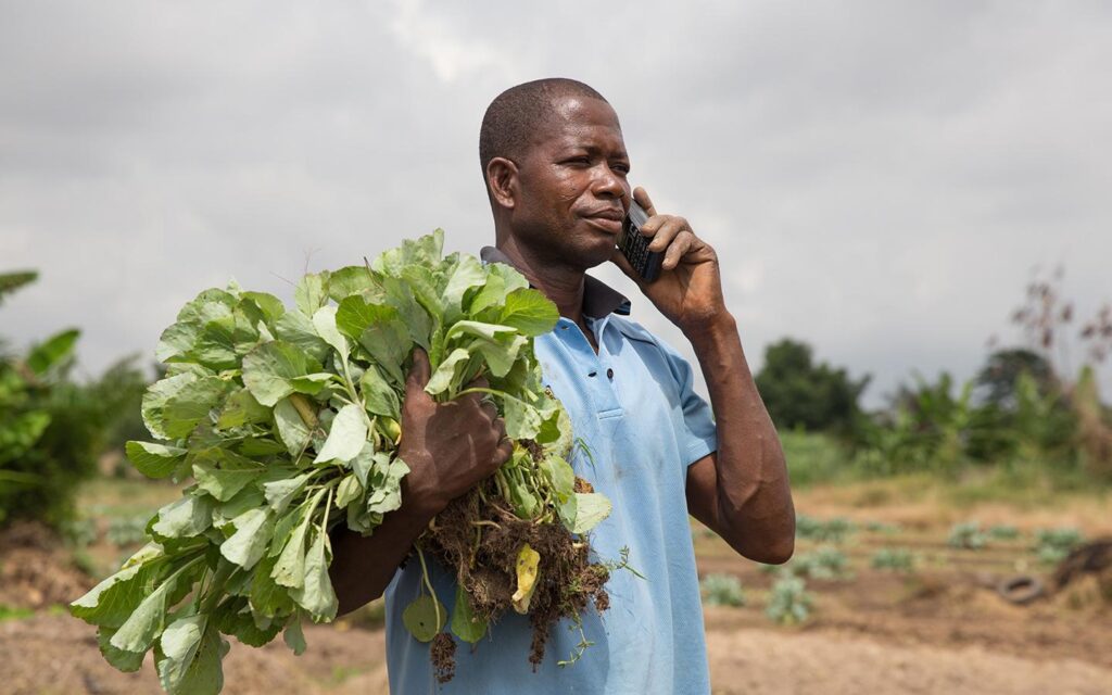 farmer using moile phone for inquiry