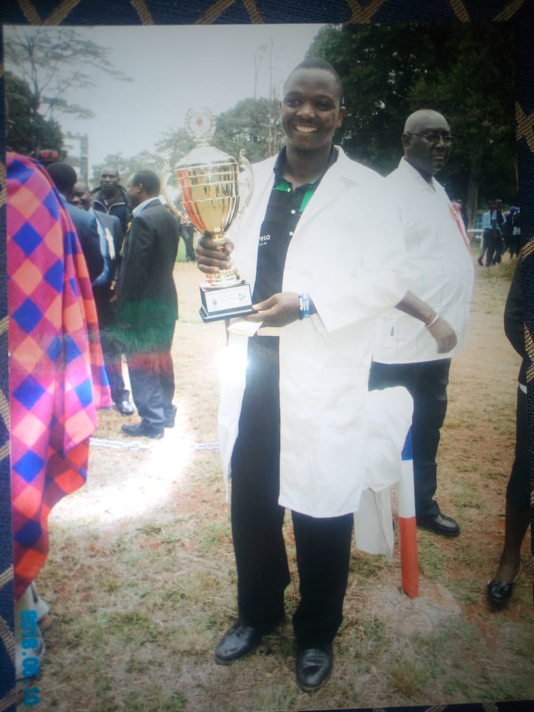 Robert Macharia with a trophy