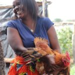 wangari holding a chicken