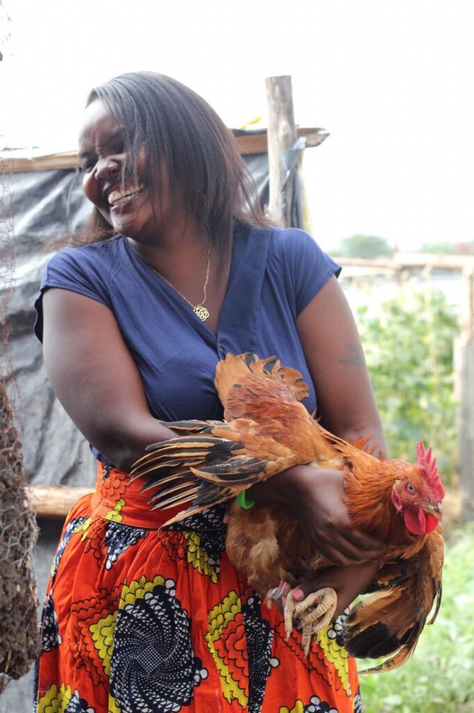 wangari holding a chicken