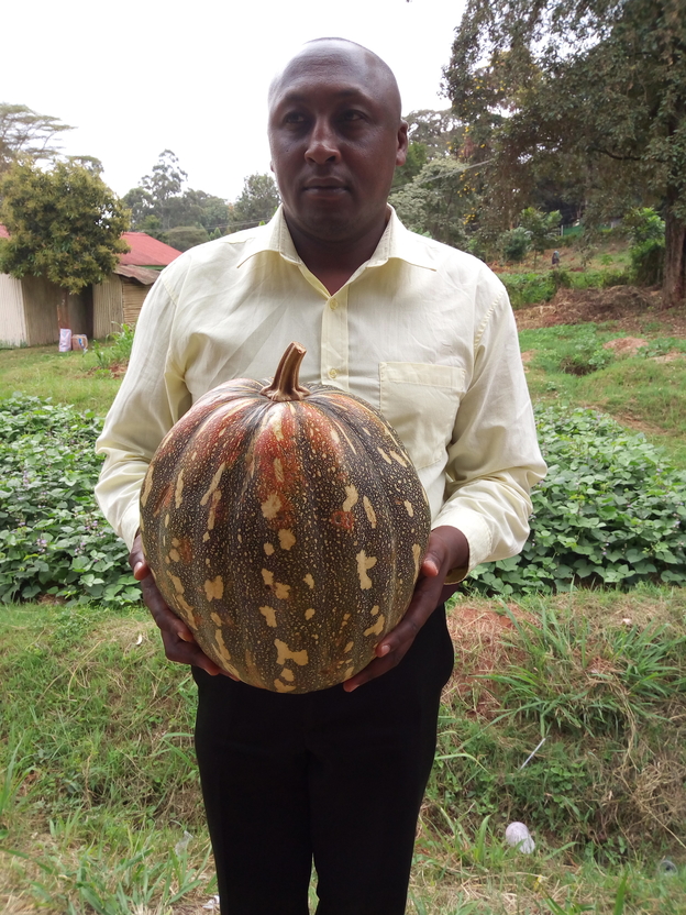 William Githinji holding a pumpkin