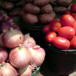 Increased rainfall could lead to onion & tomato panic sales